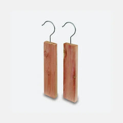 Natural cedar wood hangers with metal hooks for luxury garment care and storage