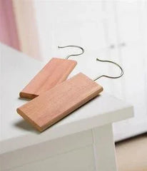 Natural cedar wood hangers for luxury garment care, eco-friendly storage solution