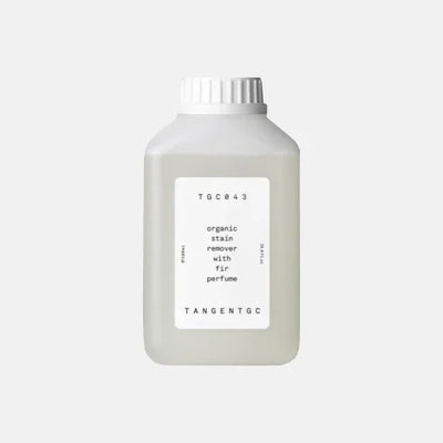 Organic stain remover with fir perfume in minimalist bottle, eco-friendly garment care solution