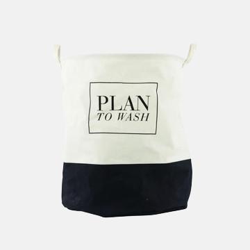 Cream and navy canvas laundry bag with 'PLAN TO WASH' text, ideal for luxury garment care