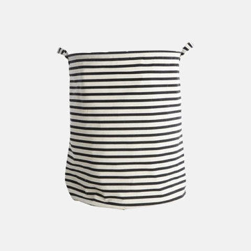 Black and white striped fabric laundry basket with handles, ideal for luxury garment care storage