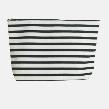 Black and white striped canvas pouch, ideal for luxury garment care essentials