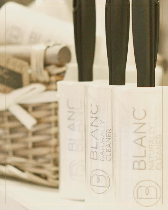 A Blanc specialist inspecting fine fabric at the atelier
